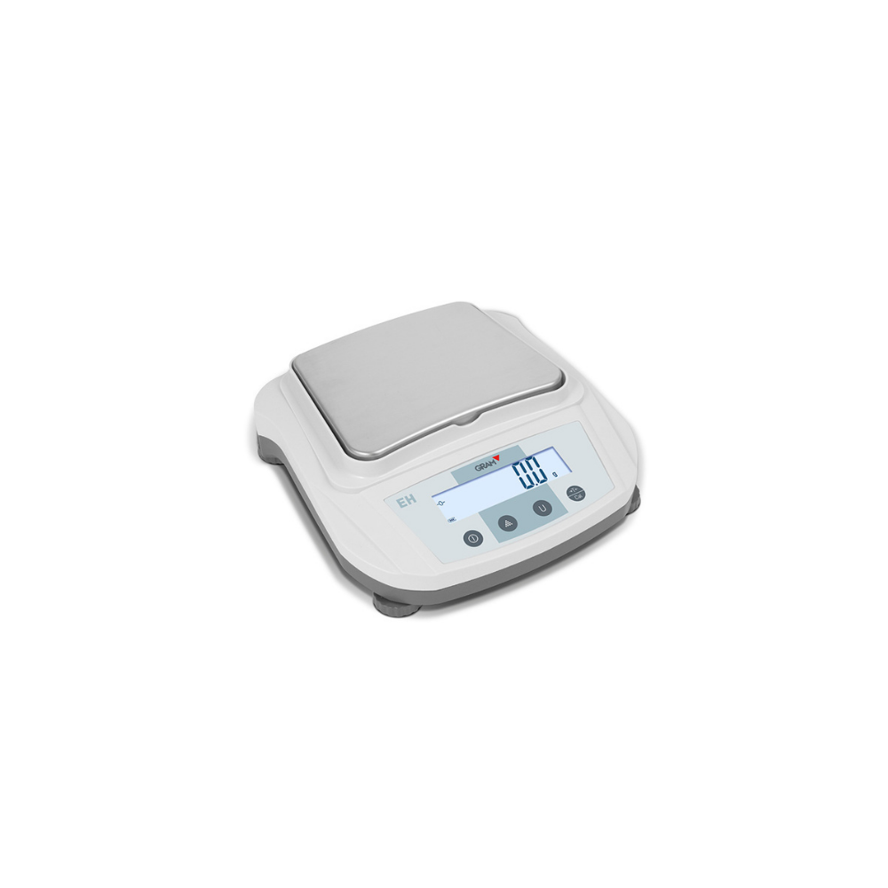 Balança de precisão GRAM Fábrica das etiquetas, mostra a leitura de peso em uma bandeja de medição.